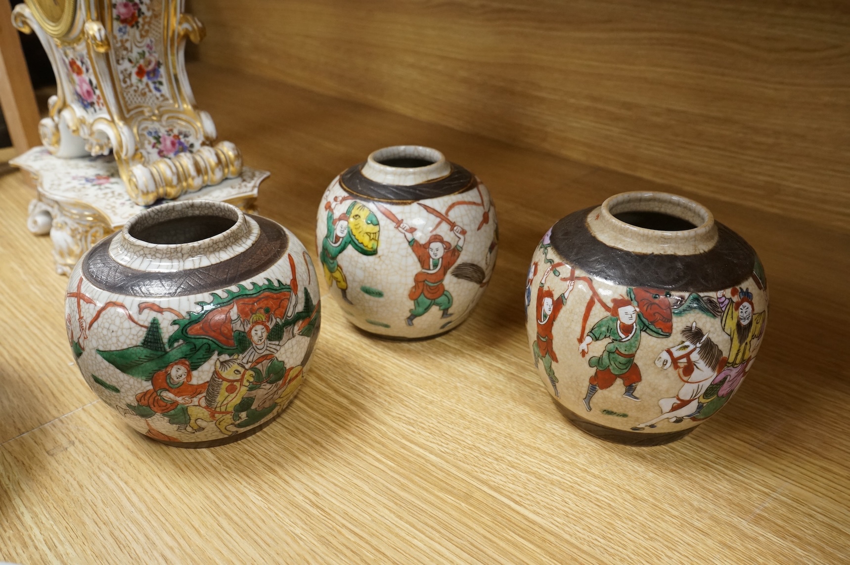 Three Chinese crackleglaze 'Warriors' jars without covers and two Chinese enamelled porcelain bowls. Largest bowl 20cm diameter.